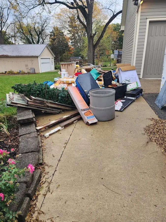 Dumpster being loaded with debris for 3 Yard Dumpster Rental in Beckett Ridge